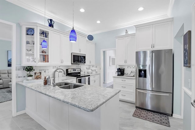 109 Lake Mariam Way, Winter Haven, FL 33884 - kitchen with appliances with stainless steel finishes, a sink, glass insert cabinets, crown molding, and a peninsula