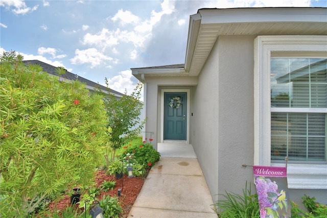 879 Orleans Dr, Eagle Lake, FL 33839 - property entrance with stucco siding