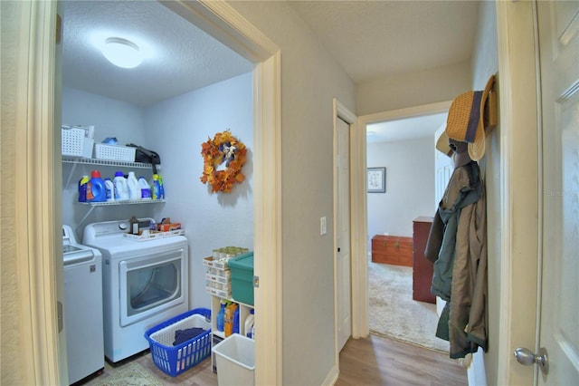 879 Orleans Dr, Eagle Lake, FL 33839 - washroom with independent washer and dryer, wood finished floors, and a textured ceiling