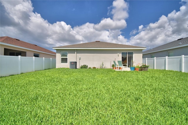879 Orleans Dr, Eagle Lake, FL 33839 - back of house featuring stucco siding and cooling unit
