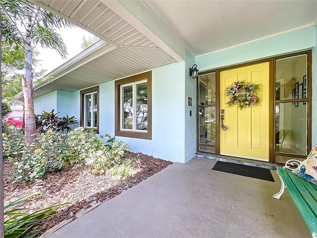 255 Lake Link Rd, Winter Haven, FL 33884 - entrance to property with stucco siding and a porch