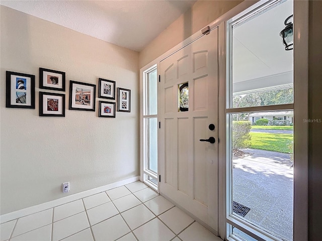 255 Lake Link Rd, Winter Haven, FL 33884 - entrance foyer featuring light tile patterned floors and baseboards