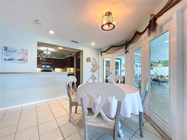 255 Lake Link Rd, Winter Haven, FL 33884 - dining area with recessed lighting and light tile patterned flooring