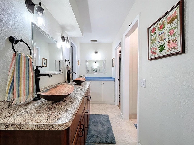 255 Lake Link Rd, Winter Haven, FL 33884 - bathroom featuring vanity, tile patterned floors, and a textured wall