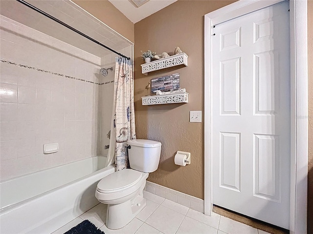 255 Lake Link Rd, Winter Haven, FL 33884 - full bath with tile patterned flooring, toilet, baseboards, and shower / bath combo