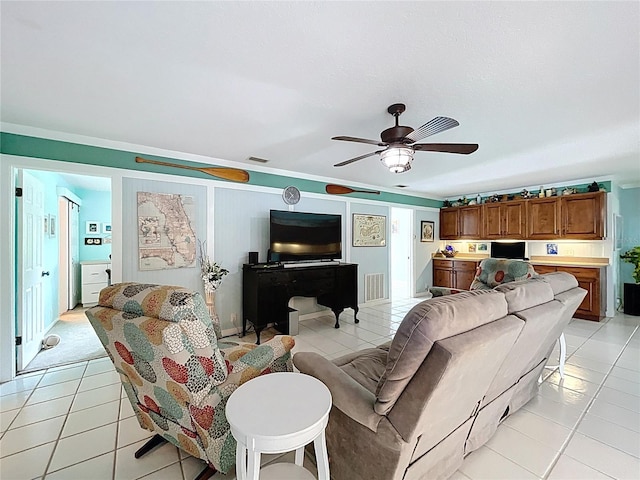 255 Lake Link Rd, Winter Haven, FL 33884 - living room with light tile patterned floors and a ceiling fan