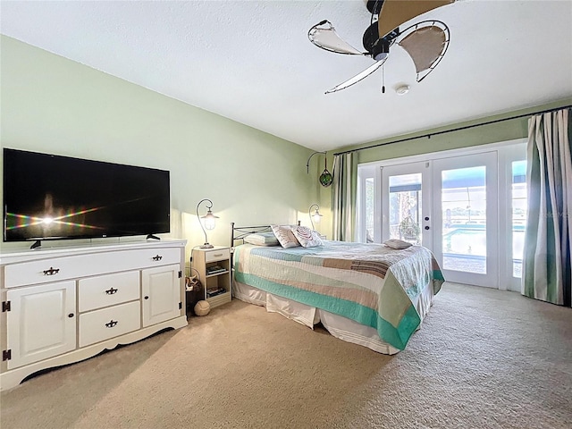 255 Lake Link Rd, Winter Haven, FL 33884 - bedroom with light carpet, access to exterior, french doors, and a ceiling fan