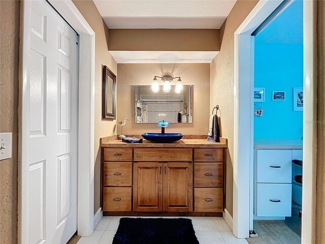 255 Lake Link Rd, Winter Haven, FL 33884 - bathroom featuring tile patterned floors, vanity, and a textured wall