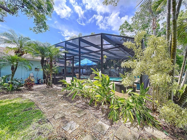 255 Lake Link Rd, Winter Haven, FL 33884 - rear view of house with an outdoor pool and a lanai