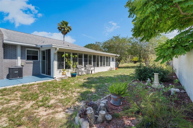 1408 Thousand Roses Dr S, Lake Wales, FL 33853 - view of yard featuring central air condition unit and a sunroom