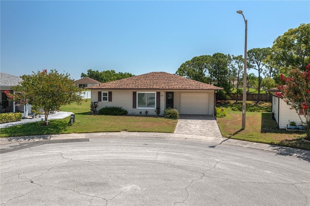 3245 Prairie Dunes Cir E, Lakeland, FL 33810 - ranch-style house with an attached garage and driveway