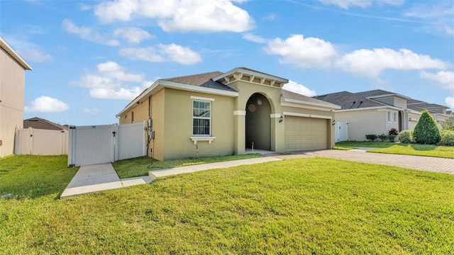 428 Aragosa Dr, Davenport, FL 33837 - mediterranean / spanish-style home with a gate, stucco siding, decorative driveway, an attached garage, and roof with shingles
