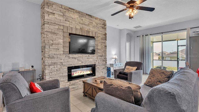 428 Aragosa Dr, Davenport, FL 33837 - living room with ceiling fan, a fireplace, and light tile patterned flooring