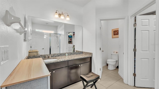 428 Aragosa Dr, Davenport, FL 33837 - full bathroom featuring tile patterned floors, a shower stall, toilet, and vanity