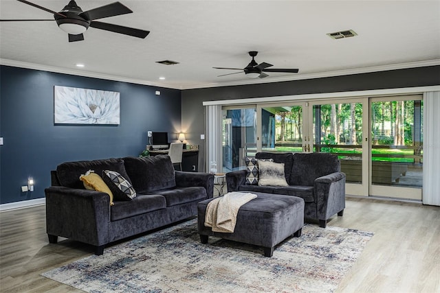 418 N Rd, Lakeland, FL 33809 - living room featuring ceiling fan, healthy amount of natural light, crown molding, wood finished floors, and baseboards