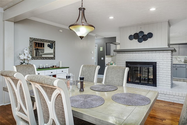 418 N Rd, Lakeland, FL 33809 - dining room featuring wood finished floors, ornamental molding, a fireplace, and recessed lighting