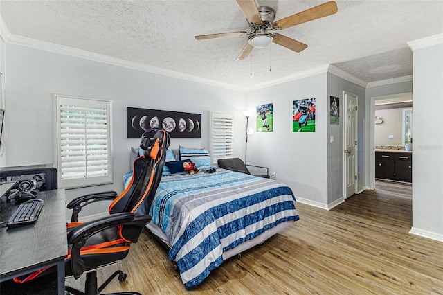 418 N Rd, Lakeland, FL 33809 - bedroom featuring wood finished floors, a desk, baseboards, a textured ceiling, and ornamental molding