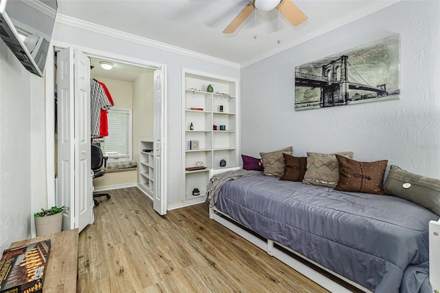 418 N Rd, Lakeland, FL 33809 - bedroom with wood finished floors, ornamental molding, baseboards, and ceiling fan
