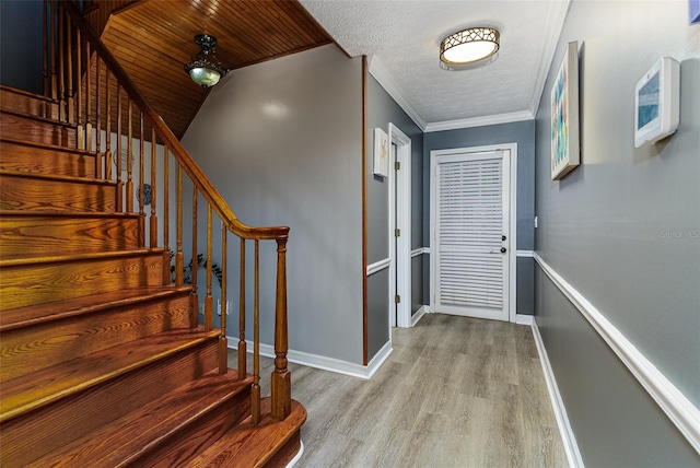 418 N Rd, Lakeland, FL 33809 - foyer with wood finished floors, stairway, baseboards, and ornamental molding