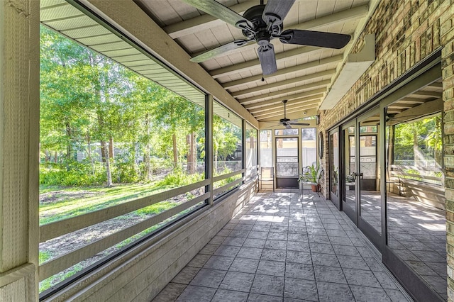 418 N Rd, Lakeland, FL 33809 - unfurnished sunroom featuring a ceiling fan, beam ceiling, and french doors