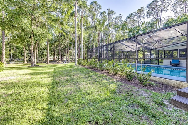 418 N Rd, Lakeland, FL 33809 - view of grassy yard with an outdoor pool and a lanai