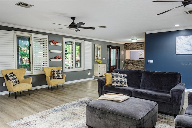 418 N Rd, Lakeland, FL 33809 - living area with a ceiling fan, crown molding, wood finished floors, and baseboards