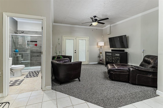418 N Rd, Lakeland, FL 33809 - living area featuring french doors, ceiling fan, tile patterned flooring, a textured ceiling, and ornamental molding