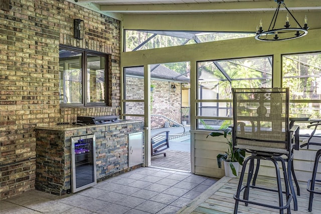 418 N Rd, Lakeland, FL 33809 - sunroom featuring beverage cooler, area for grilling, and healthy amount of natural light