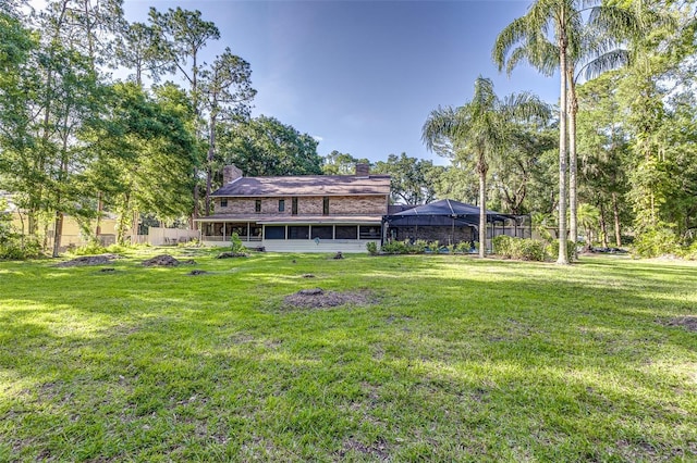418 N Rd, Lakeland, FL 33809 - view of green lawn featuring a lanai