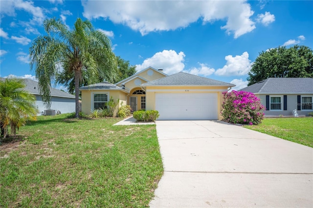 630 Heather Glen Loop, Winter Haven, FL 33884 - ranch-style house featuring driveway, an attached garage, a front yard, stucco siding, and central AC