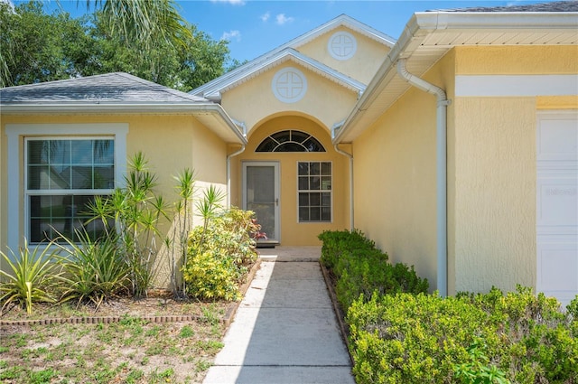 630 Heather Glen Loop, Winter Haven, FL 33884 - doorway to property with stucco siding