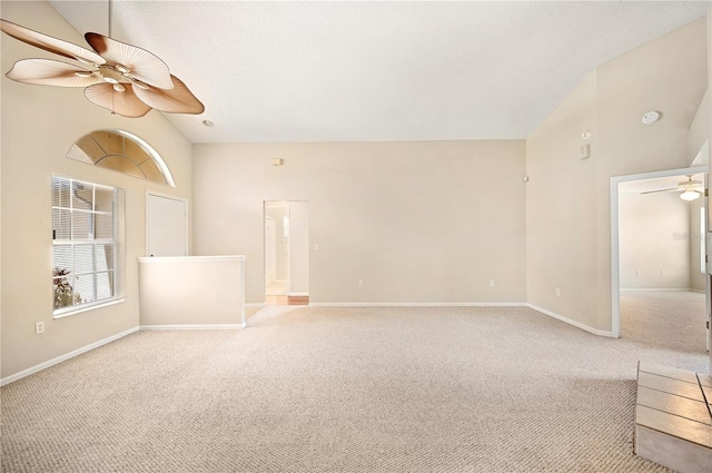 630 Heather Glen Loop, Winter Haven, FL 33884 - unfurnished living room with ceiling fan, carpet, baseboards, and high vaulted ceiling