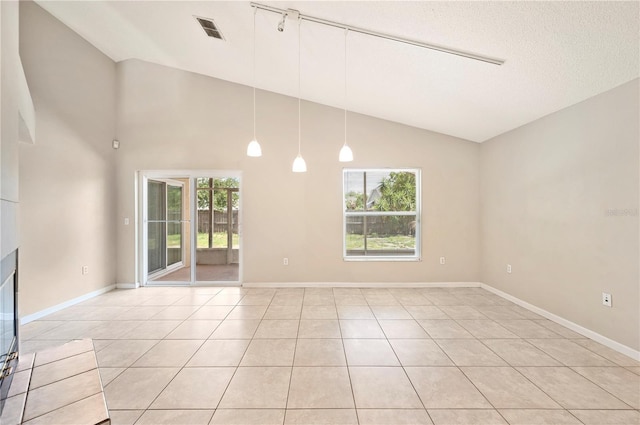 630 Heather Glen Loop, Winter Haven, FL 33884 - unfurnished room with vaulted ceiling, light tile patterned floors, and baseboards