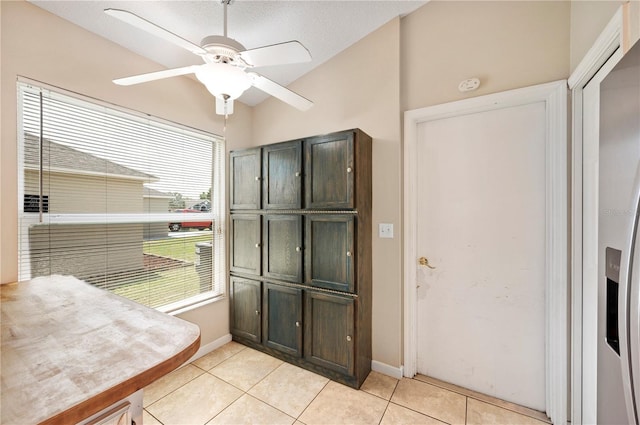 630 Heather Glen Loop, Winter Haven, FL 33884 - doorway to outside with light tile patterned flooring, a ceiling fan, baseboards, and lofted ceiling