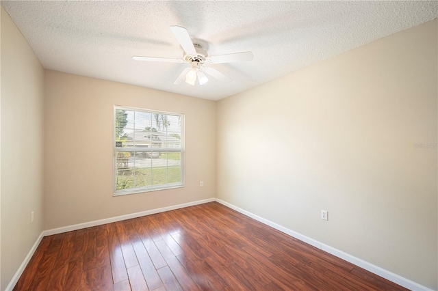 630 Heather Glen Loop, Winter Haven, FL 33884 - empty room with dark wood-style floors, baseboards, a textured ceiling, and ceiling fan