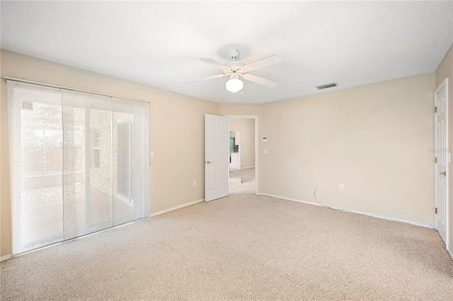 630 Heather Glen Loop, Winter Haven, FL 33884 - unfurnished bedroom with light colored carpet, baseboards, access to outside, and a ceiling fan