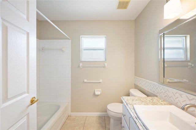 630 Heather Glen Loop, Winter Haven, FL 33884 - bathroom featuring tile patterned flooring, toilet, vanity, and shower / bathtub combination
