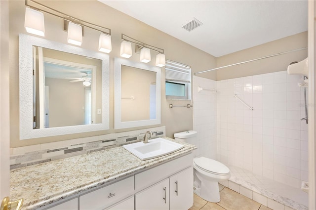630 Heather Glen Loop, Winter Haven, FL 33884 - full bath featuring toilet, a ceiling fan, a tile shower, and vanity