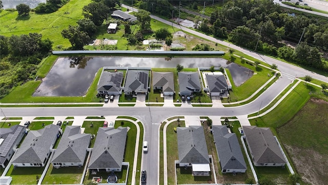648 Lorient Dr, Eagle Lake, FL 33839 - aerial perspective of suburban area with a nearby body of water