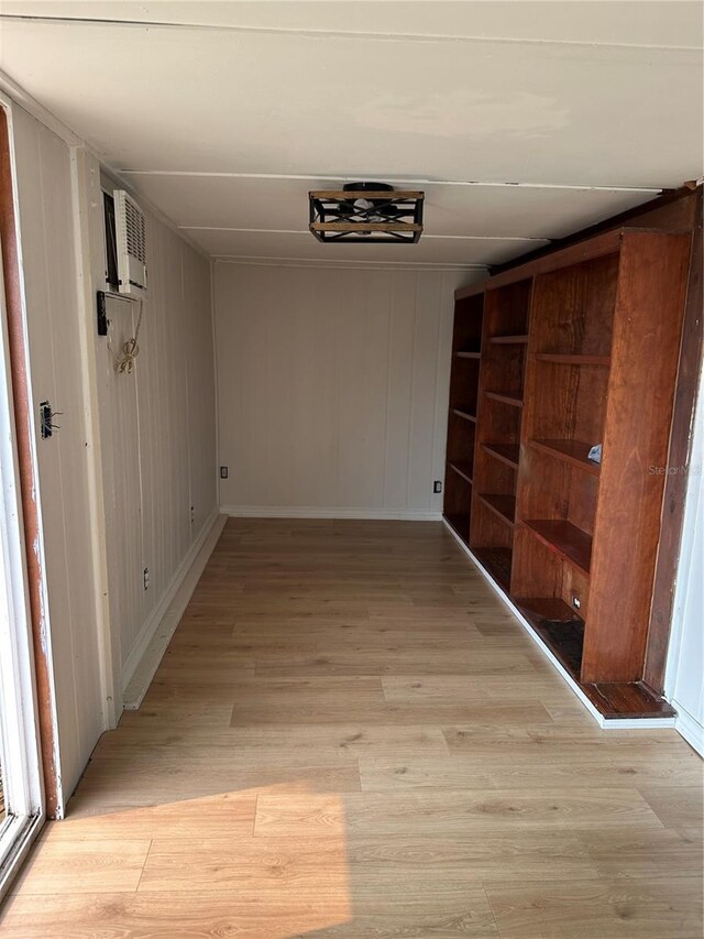 9402 Cat Track Trl, Lake Wales, FL 33898 - hallway featuring light wood finished floors and baseboards