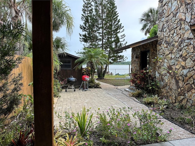 9402 Cat Track Trl, Lake Wales, FL 33898 - view of patio / terrace featuring fence and a water view
