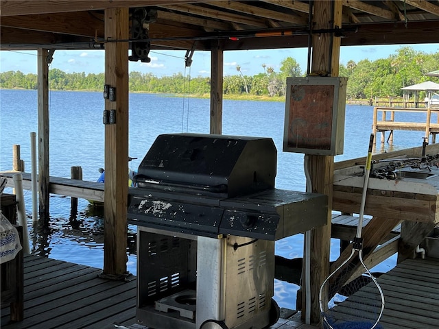 9402 Cat Track Trl, Lake Wales, FL 33898 - dock area featuring a water view and view of scattered trees