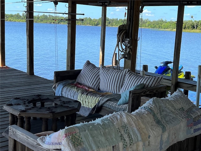 9402 Cat Track Trl, Lake Wales, FL 33898 - dock with a water view, boat lift, and view of scattered trees
