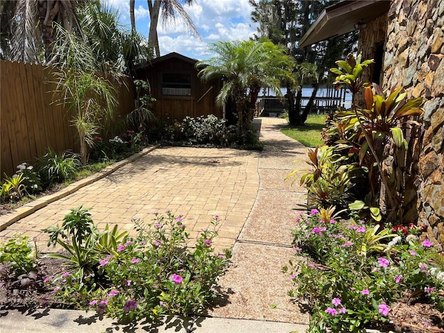 9402 Cat Track Trl, Lake Wales, FL 33898 - view of patio featuring fence and an outdoor structure