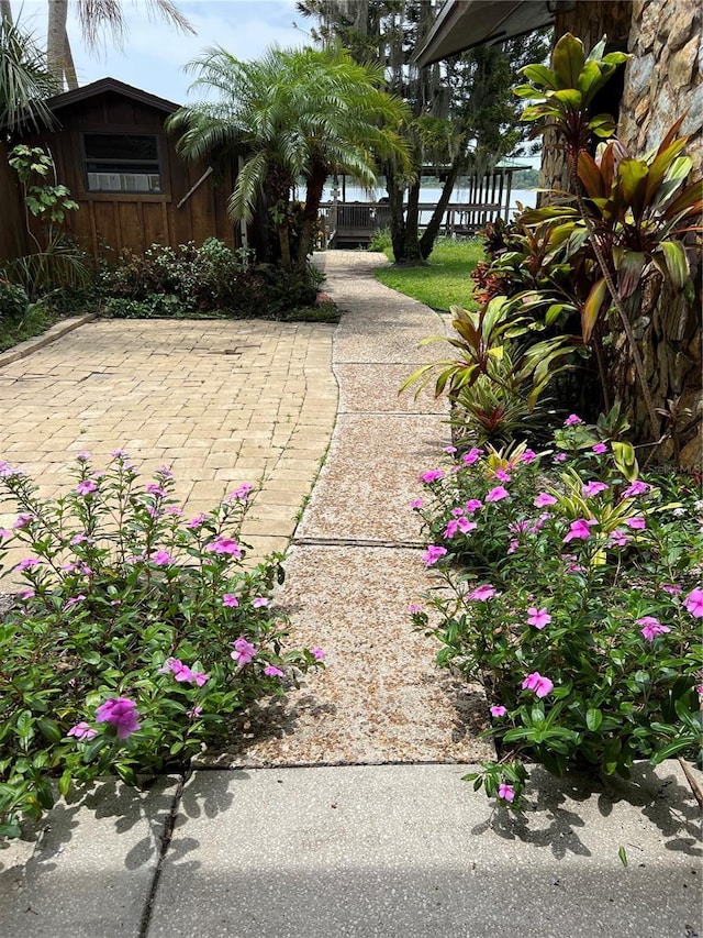9402 Cat Track Trl, Lake Wales, FL 33898 - view of patio / terrace with fence, a water view, and an outbuilding