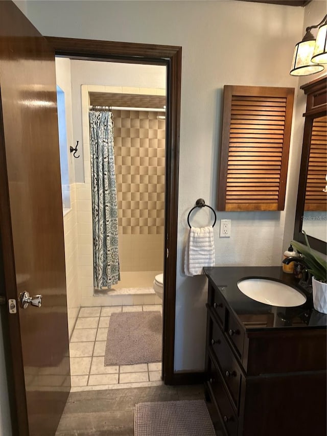 9402 Cat Track Trl, Lake Wales, FL 33898 - bathroom with a shower stall, vanity, toilet, and tile patterned flooring