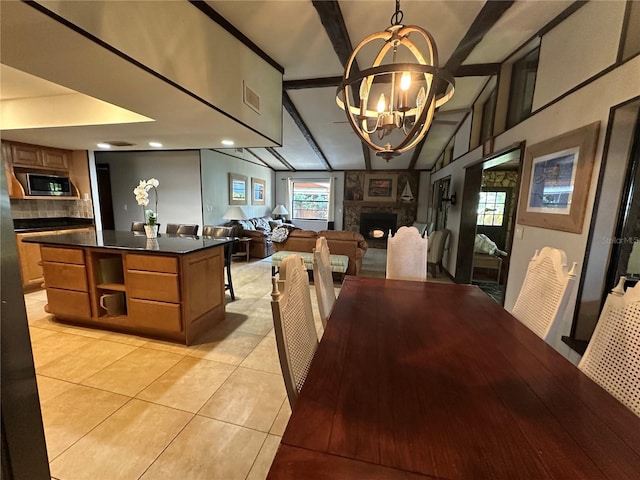 9402 Cat Track Trl, Lake Wales, FL 33898 - dining room featuring a fireplace, a chandelier, light tile patterned floors, and recessed lighting