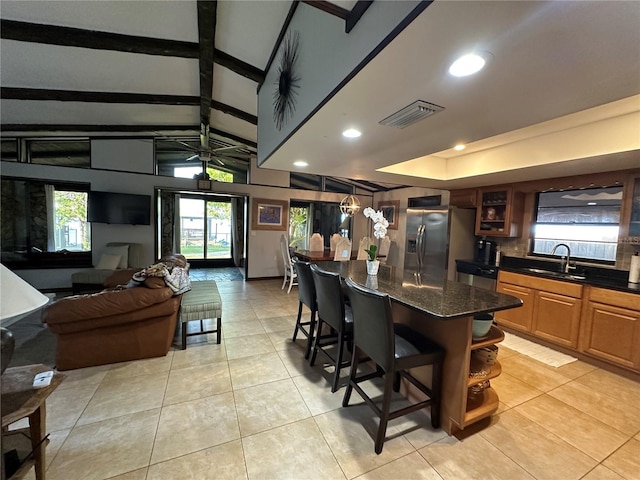 9402 Cat Track Trl, Lake Wales, FL 33898 - kitchen featuring stainless steel fridge with ice dispenser, a sink, a breakfast bar, light tile patterned floors, and recessed lighting