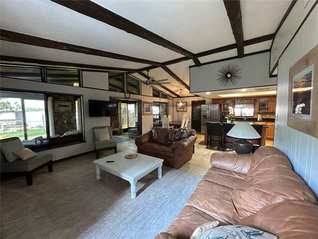 9402 Cat Track Trl, Lake Wales, FL 33898 - living area featuring plenty of natural light, beam ceiling, ceiling fan, and high vaulted ceiling