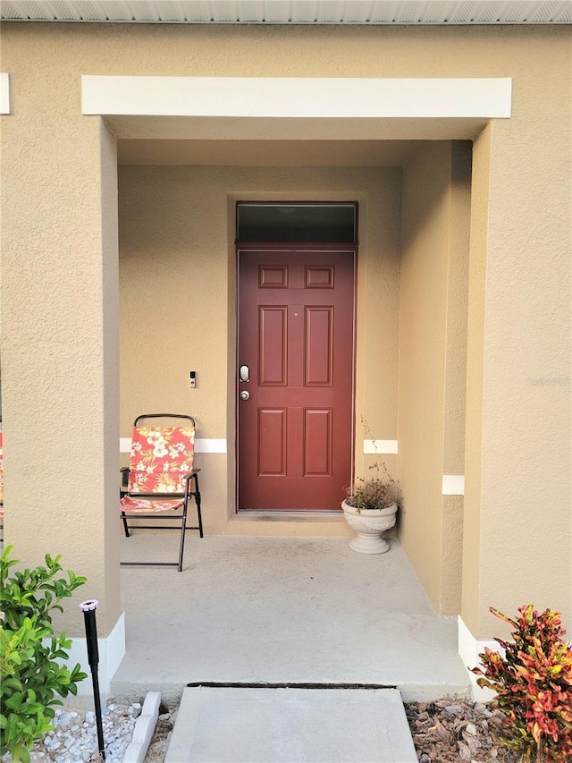 1378 Fox Squirrel Dr, Davenport, FL 33897 - view of exterior entry with stucco siding
